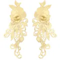 Detailed macro view of symmetric 3D water-soluble lace floral appliques in pale gold - Beige
