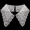 Macro detail of white milk silk water-soluble hollow-out lace fake collar on black background - White