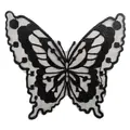 Detailed macro shot of a black butterfly embroidered patch on translucent organza mesh - Style 523 / Black