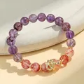 Elegant purple and strawberry crystal beaded bracelet with a golden snake charm for women - Purple Phantom & Hematoid Quartz