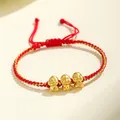 Bracelet tressé rouge fait main avec trois jolis pendentifs de serpent dorés porte-bonheur - Style Trois Serpents