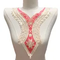 Detailed view of red and white floral embroidered lace neckline applique on a mannequin. - Red