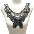 Detail view of a black butterfly lace embroidery collar on a white mannequin torso. - Black
