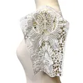 Close-up view of intricate white water-soluble lace embroidery applique on a mannequin - Sleeve Patches (Pair)
