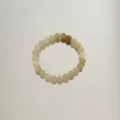 Close-up of handmade natural aventurine jade beaded bracelet in pastel candy colors. - Aventurine Round Beads / Afghan Green