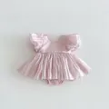 Detailed view of the pink baby girl puff sleeve dress, delicate fabric and cute style. - 66cm / Pink