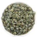 Detail shot of blue-green pumpkin beads with metallic edges, perfect for DIY jewelry making. - 100 Pieces (10g) / Clear