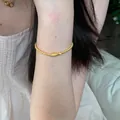 Gold color beaded bracelet with unique charm design, elegant wrist jewelry for women daily wear. - Gold Pendant Beaded Style (MY30631)