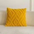 Housse de coussin tuftée jaune avec motif de losanges géométriques pour canapé. - Jaune