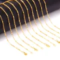 Close-up of multiple minimalist gold-plated stainless steel bead cross chains for jewelry - Chain Only (NC2022) / 45cm / Gold