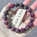Close-up of purple and grey Bodhi seed bracelet with detailed engraved Sanskrit mantras. - Purple Grape Mantra Style