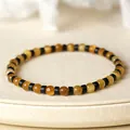 Elegante pulsera de cuentas de ojo de tigre amarillo de 4 mm con separadores - Dorado