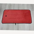 Red super absorbent coral fleece pet bath towel featuring a cute black paw print design - Red