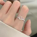 Elegant 925 sterling silver minimalist twisted band ring with peace sign symbol charm - Twist Hollow Ring Style (JZ1112) / Adjustable Open / Silver