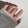 Minimalist 925 sterling silver twist band ring displayed on a hand with soft shadows - Minimalist Twisted Rope Style (JZ0558) / Adjustable Open / Silver