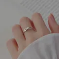 Elegant 925 sterling silver bow-knot ring on female finger for a minimalist look - Bowknot Shape Style (JZ0169) / Adjustable Open / Silver