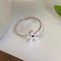 Elegant 925 sterling silver open ring featuring a hammered flower with a black gem - Hammered Flower Black Rhinestone Style (JZ0224) / Adjustable Open / Silver