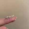 925 sterling silver adjustable ring with cute bow knots in a minimalist silver finish - Continuous Bowknot Splicing Style (JZ0620) / Adjustable Open / Silver