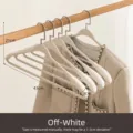 Frosted wide-shoulder hangers in creamy white for non-slip coat and jacket storage - Cream White