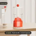 Creamy red rotating makeup brush storage tube with a modern press-to-lift design - Press Lift / Milk Red