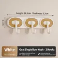 Minimalist white elliptical 3-hook wall rack featuring a natural wood grain texture finish - Oval 3-Hook White