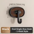 Sleek black oval wall hook with walnut wood grain inlay, durable HIPS, 5x5.1x3.2cm - Oval 1-Hook Black