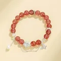 Bracelet élégant composé de cristaux rouges avec un pendentif lotus en argent et perle - Style Quartz Fraise