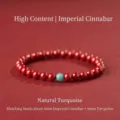 6mm Emperor Cinnabar beaded bracelet featuring a natural turquoise accent bead - Emperor Cinnabar Artificial Turquoise Style / 6mm