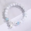 Elegante pulsera de cuentas de ojo de gato blancas con detalles azules y dije de lirio - Blanco (Lirio de los Valles)