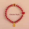 Elegant red cinnabar bead bracelet for women featuring a citrine accent and gold lucky charms - Blessing Cinnabar Citrine Style