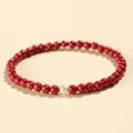Elegant red cinnabar beaded bracelet for women featuring a single white pearl accent bead. - 4MM Bead Diameter / 4mm Cinnabar Red With White Pearl