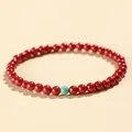 Elegant red cinnabar bead bracelet featuring a single turquoise accent bead for women - Emperor Cinnabar Artificial Turquoise Style / 4mm