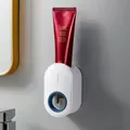 White and blue automatic wall-mounted toothpaste dispenser for bathroom organization - White And Ocean Blue