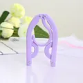 Durable purple plastic folding travel clothes hanger with non-slip compact design - Violet