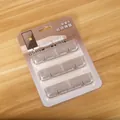 Set di 3 organizzatori di cavi autoadesivi grigio trasparente in confezione retail - Set da 3 Pezzi / Nero Traslucido