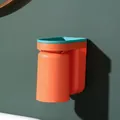 Wall-mounted toothbrush holder with upside-down orange rinsing cup for home bathroom - Orange