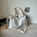Lightweight white travel duffel bag with black polka dots, cream straps, and spacious interior. - One Size / Off White