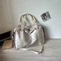Large capacity lightweight travel bag featuring a polka dot pattern in champagne gold finish - One Size / Champagne