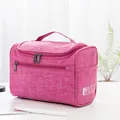Große rosa Reise-Kulturtasche mit strukturierter Stoffoberfläche und praktischem Tragegriff - Fuchsia
