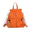 Leuchtend orangefarbener wasserdichter Nylon-Rucksack mit Kordelzug für Outdoor-Reisen - Orange