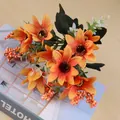 Close-up of orange artificial daisy bouquet on a book, table decor - Orange