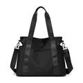 Large capacity black travel tote bag featuring fashionable woven letters on adjustable straps - One Size / Black
