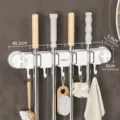 White multi-functional mop rack with suction cups and 5 hooks for bathroom storage - 3 Slots 5 Hooks / White