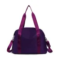 Versatile purple nylon travel bag with adjustable shoulder strap and large capacity - Deep purple