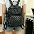 Stylish casual black washed denim backpack featuring a classic quilted front pocket design - One Size / Black