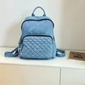 Casual light blue washed denim backpack for women with a stylish quilted front pocket - One Size / Light Blue