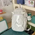 Cute white polka dot backpack with a transparent front pocket and cat plush pendant - S / Regular / White