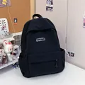 Minimalist black lightweight backpack with white embroidery for students and casual outings - One Size / Black