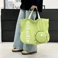 Stylish large capacity light green washed cloth tote bag featuring a matching round pouch - One Size / Green
