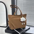 Stylish brown canvas tote bag featuring large capacity and a cute white cloud charm - One Size / Brown